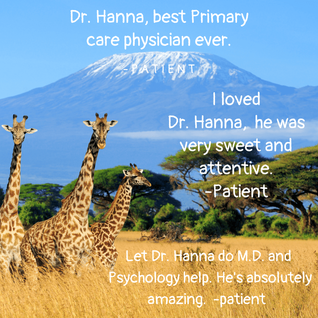 A Group of Giraffes in a Field with a Mountain Background